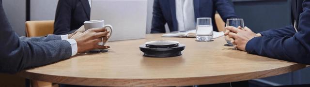 A conference room with a wireless speaker